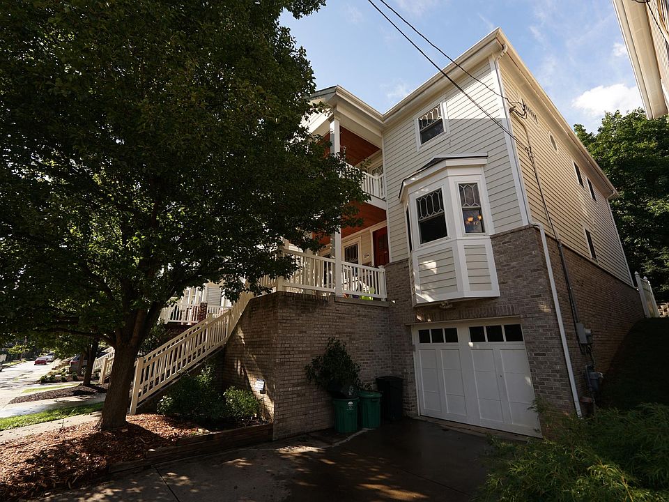 Front of home including door to tandem garage