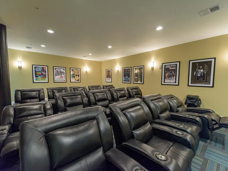 Theatre room with big screen TV & cinema-style seating