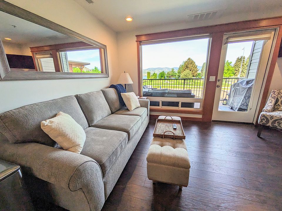 Open concept living space. Living room has a queen sofa bed, and access to the balcony.