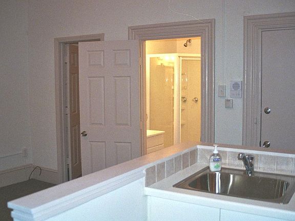 Kitchen/Living Area with View of Bath