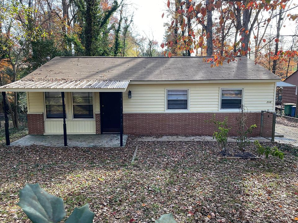 Front view of home which has a fenced front yard