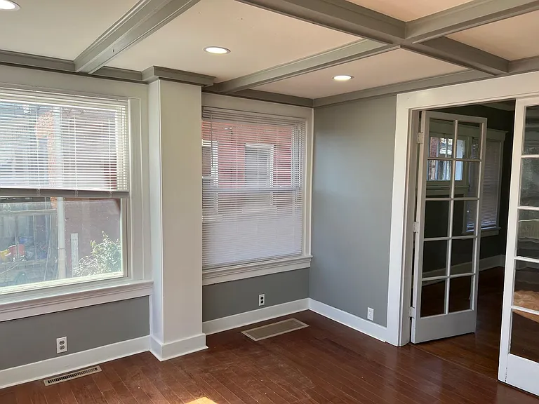 sunroom with beamed ceilings