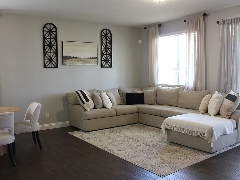 Spacious living room with large windows