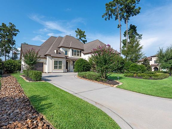 This exquisite home sits on an oversized corner lot. The mature landscaping provides awesome curb appeal and peaceful privacy.