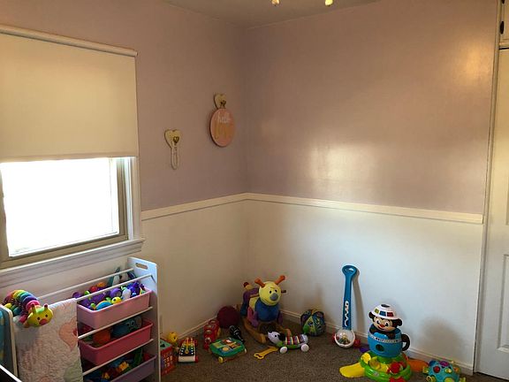 Bedroom 1, lavender with chair railing around