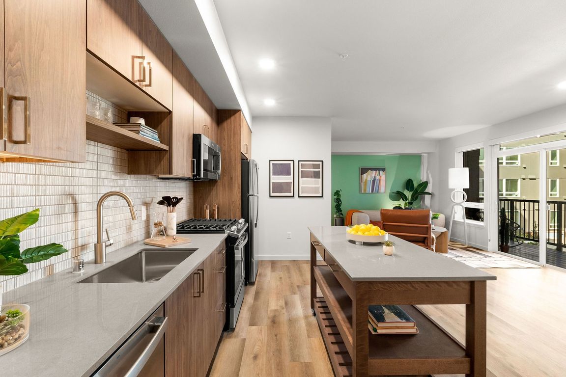 Stylish tile backsplash with quartz countertops