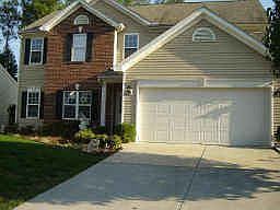 Nicely Landscaped with Partial Brick