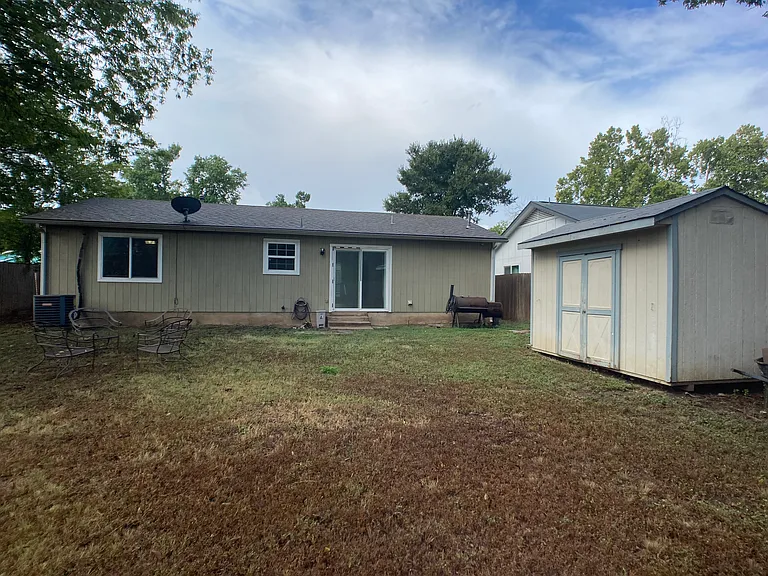 Large back yard with shed