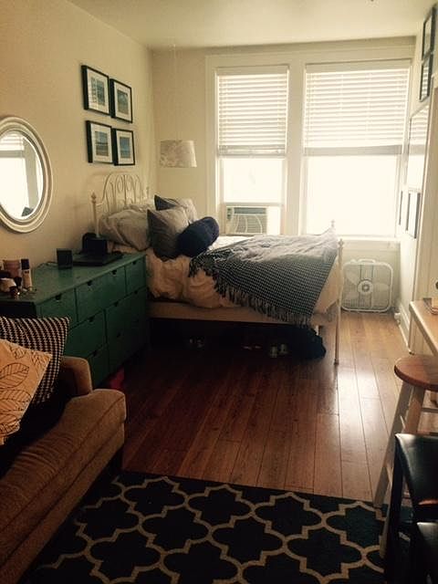 Main living room with hardwood floors. Bright and sunny!