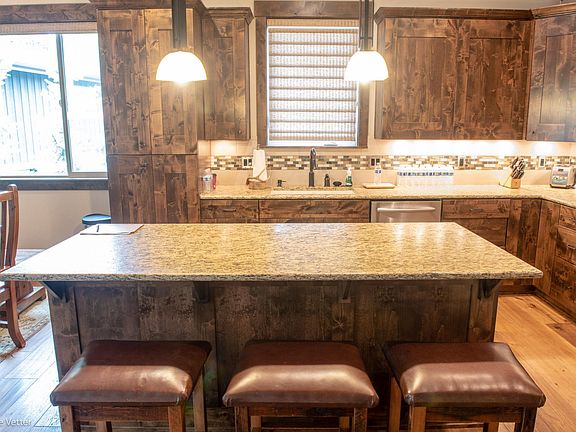 Dining area and patio doors are to the left of the kitchen.