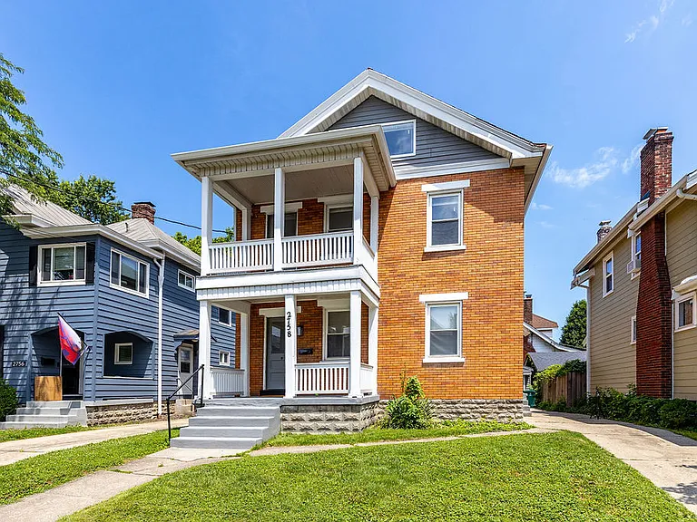 This apartment is on the second and third floors of this building within walking distance to Oakley Square.