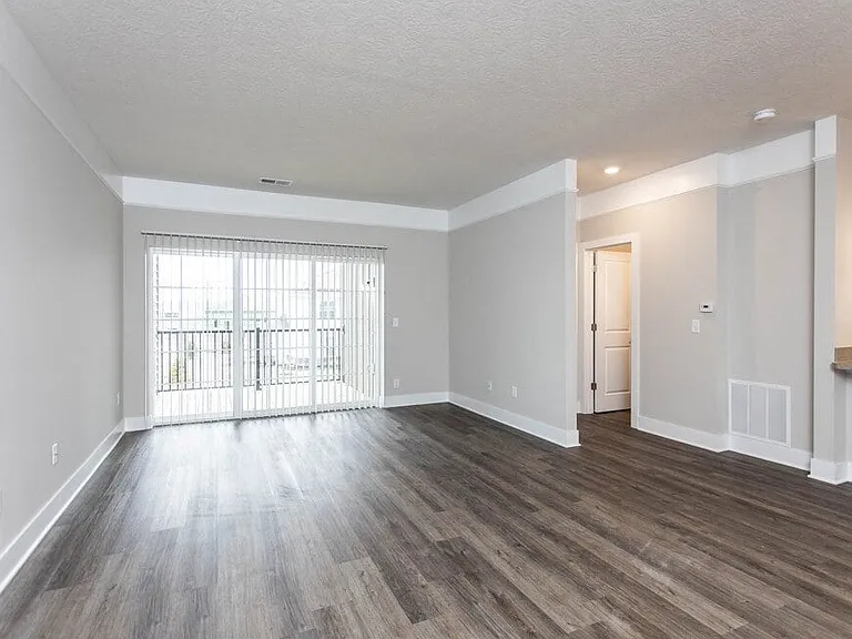 Dooley's Orchard updated apartment unit with new flooring, showing the living area off the kitchen area.