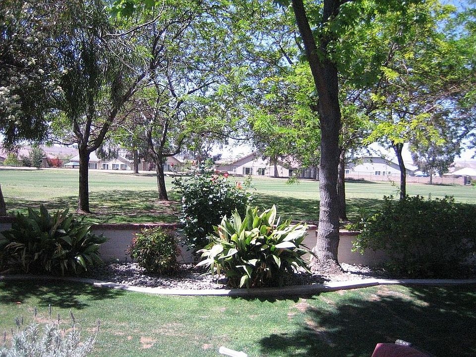 Backyard overlooks 6th fairway; Has beautiful entertaining patio