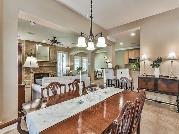 A view of the dining room looking towards the the kitchen and living room.