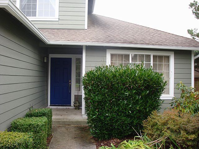 Home is surrounded by easy care mature landscaping