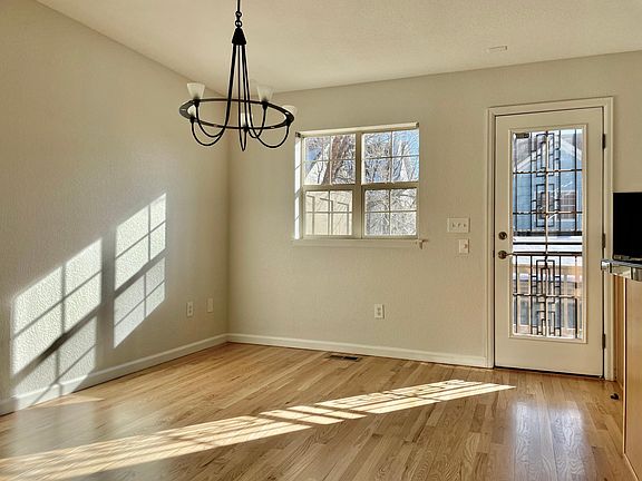 Kitchen eating area on main level with access to south-facing, sunny balcony