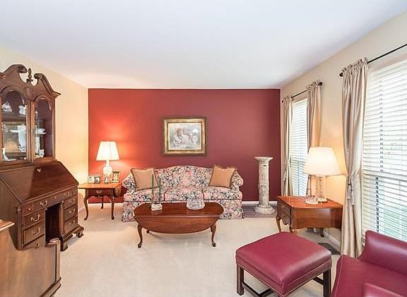 The living room is to the right of the foyer offering an abundance of natural light.