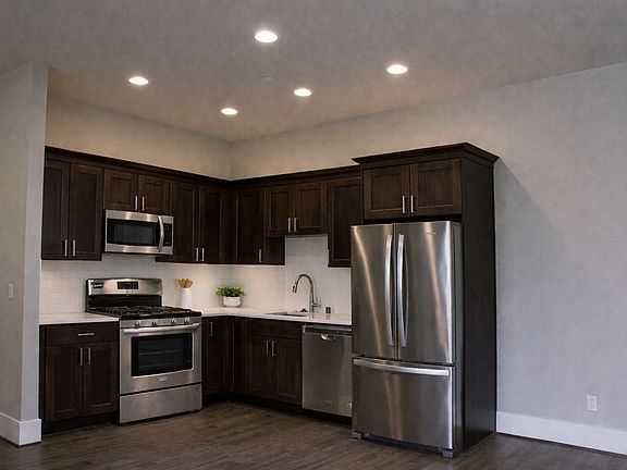 Kitchen with all steel appliances :electric stove, Microwave , DIshwasher & Refrgierator
