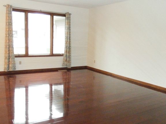 This beautiful flooring reflects the light and makes this room brighter.