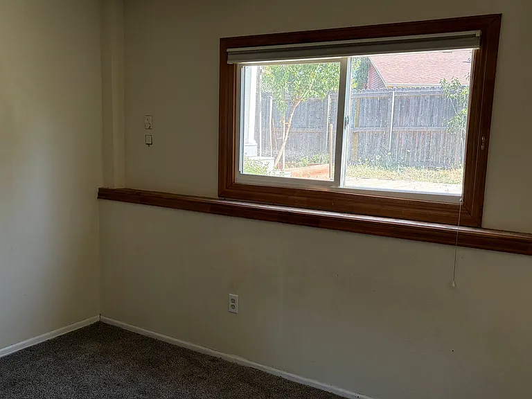 Downstairs Bedroom 4 with View to Yard