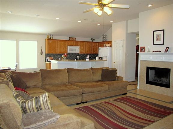 Entire house has tile flooring! Open kitchen, breakfast, living room with fireplace.