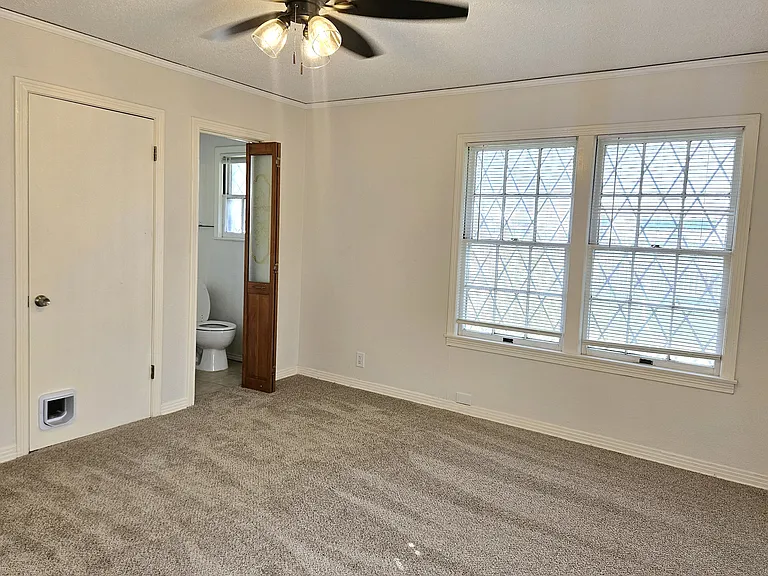 Master bedroom with closet #2 (left) and private bathroom (center)