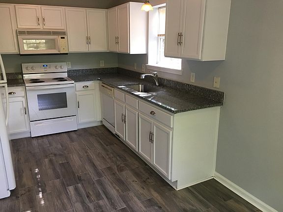 Newly painted cabinets with hardware
