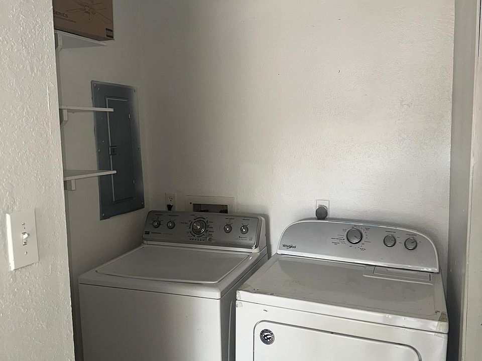 Washer and dryer connections and half bath area past the kitchen