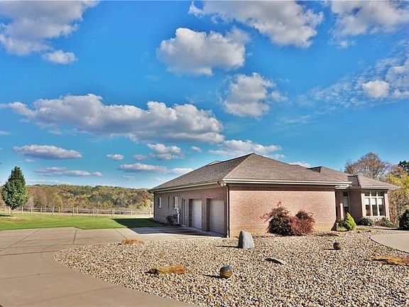 Two stall attached garage with plenty of extra parking in the 80x120 riding arena!