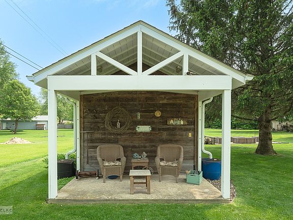 The garden shed measures 12 x 23' in all. There is a 3' covered porch in front, and a 3' covered woo