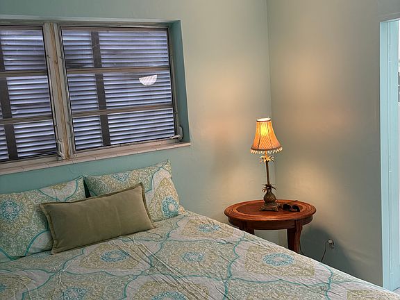 Queen size foam bed. New paint, flooring, and baseboards. Double sliding door closet with storage alcove above. Large standing wardrobe for additional storage. Brand new comforter, pillows and shams.