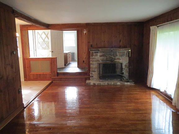 livingroom/stone fireplace/refinished floor