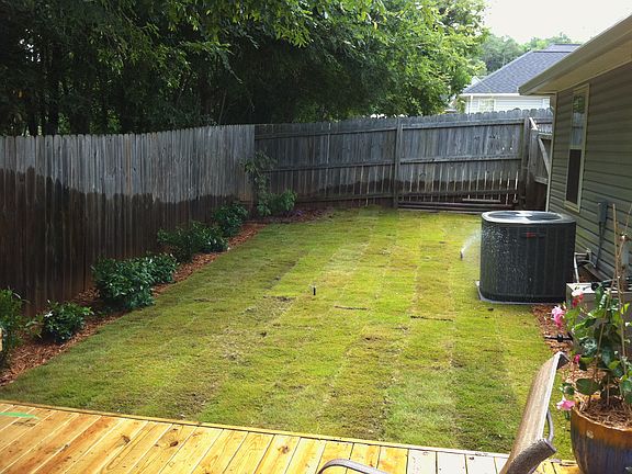 Fenced-in backyard. New deck