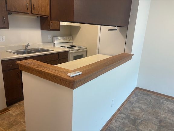Kitchen with breakfast bar. Unit in the East Building