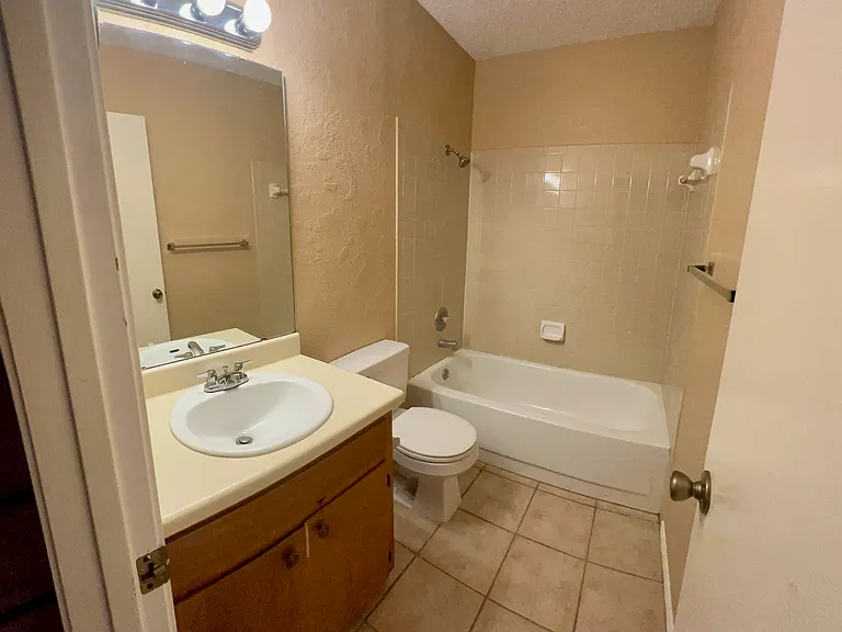 Bathroom for 2nd and 3rd bedrooms in the hallway.