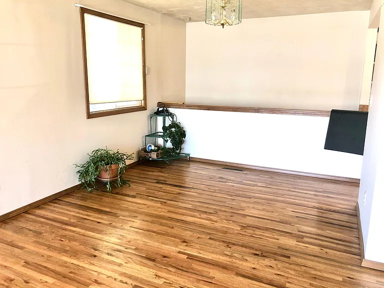 Dining room, with half-wall over the stairs to the basement.
