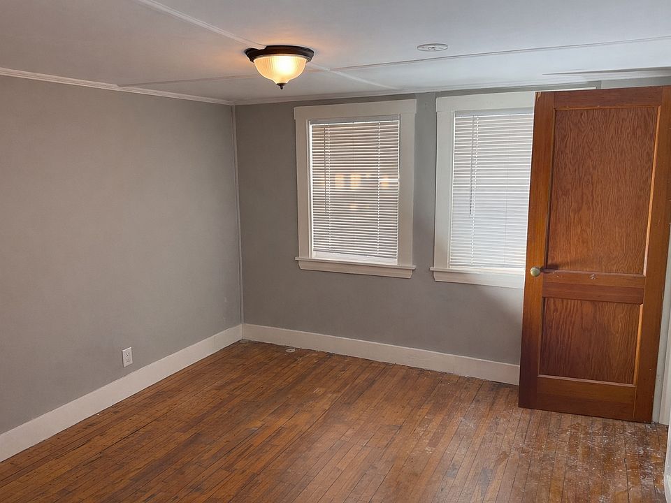 Bedroom with views out rear porch / rear of building