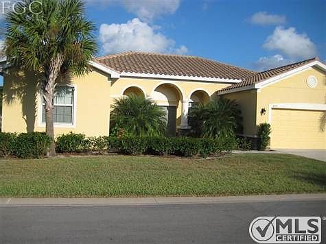 Enjoying the fantastic view of this exquisite and well cared for home - surrounded by wonderful trees, bushes and landscaping.
