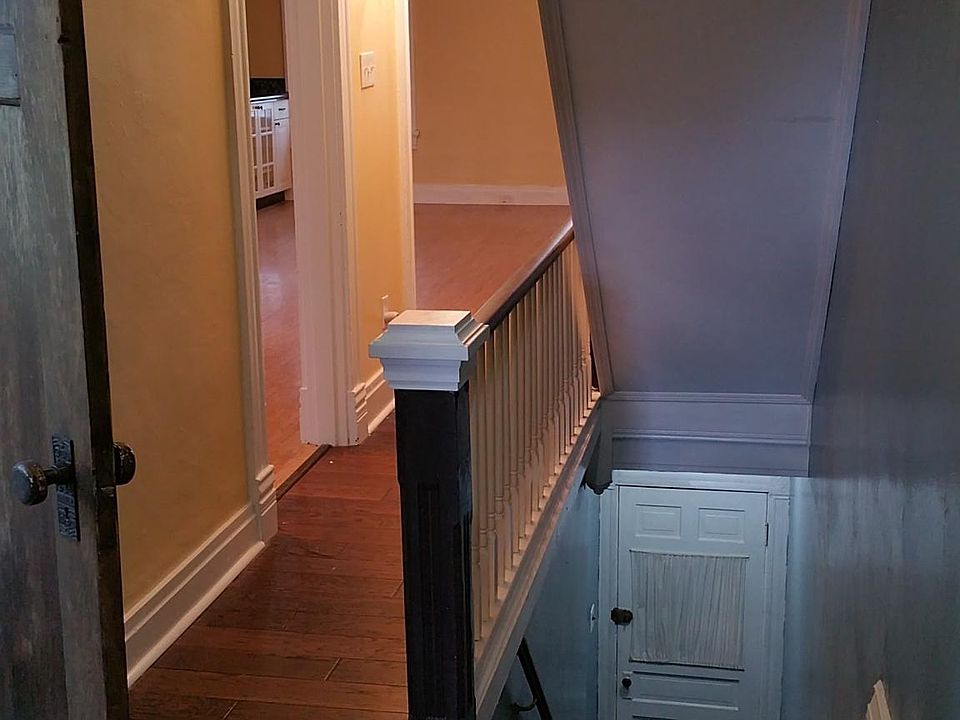 This is a second and thrid floor 2 bedroom apartment. This is the front stair entrance - door at floor and hallway looking from Kitchen doorway into front of home. The back has a second for private entrance into the kitchen