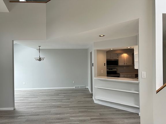 View from Living Room into Dining Room and Kitchen
