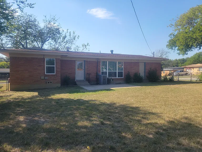 Back of house. Note New windows.