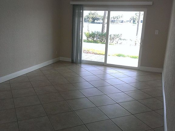 Living Room Opens To Patio and Water View
