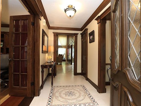 NOTICE THE UNFAILING ATTENTION TO DETAIL AS YOU ENTER THIS FABULOUS HOME - Through the sold wood door is this beautiful entry wi