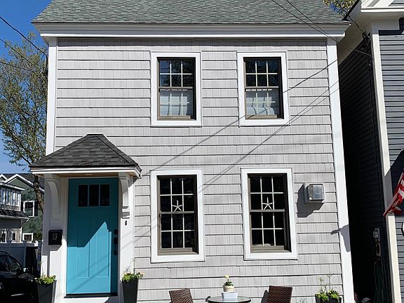Front of house w/bistro seating and planters