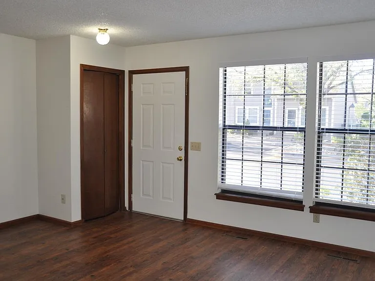 front room - front door and coat closet