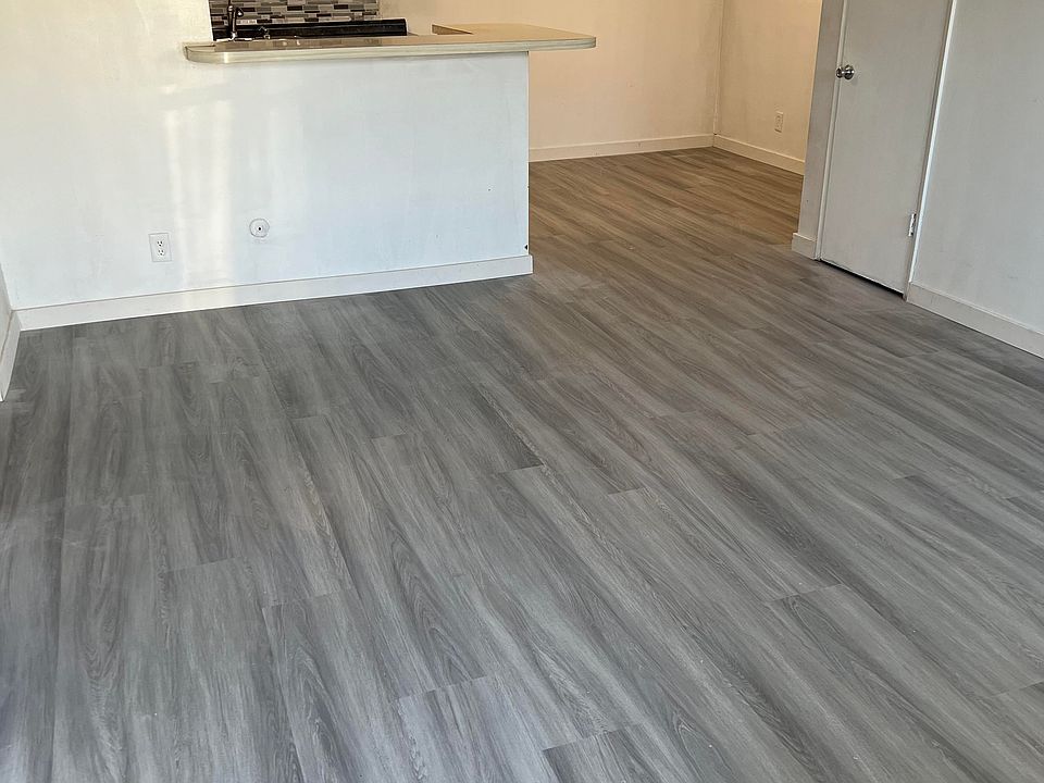 entering family room, dining room, kitchen. brand new water proof flooring throughout.