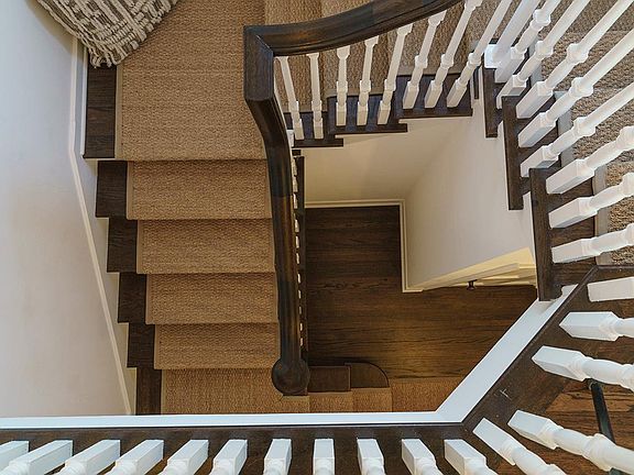 Restored hard-wood floors and sea grass welcome you home. 