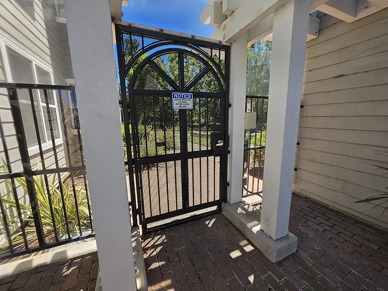Gated entry/exit to dog park