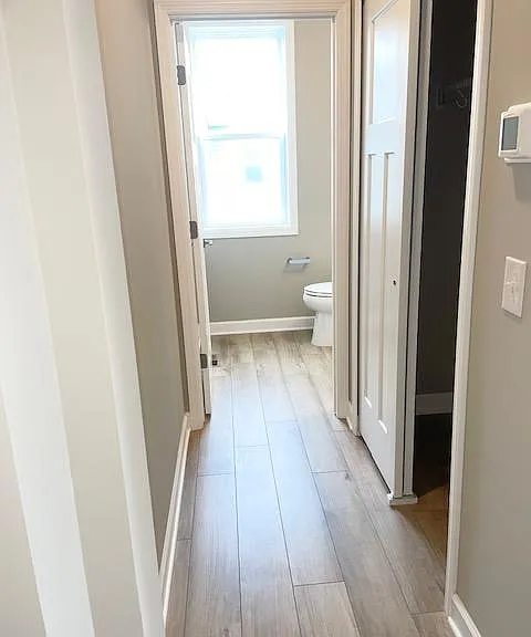 Hallway to 1/4 bathroom and closet on main level.