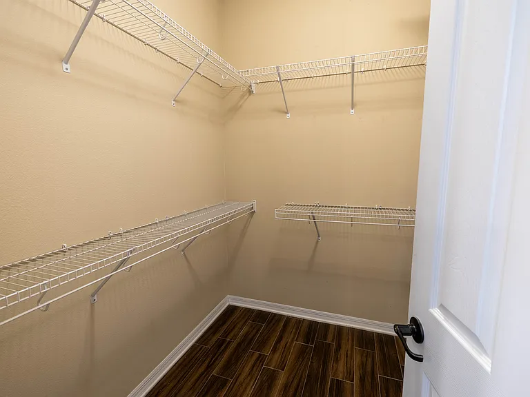 2nd of 2 Walk-in Closets in Primary Bathroom